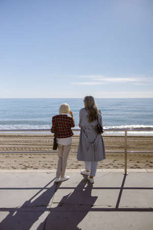 Shot of adult modern women resting outdoorsの写真素材