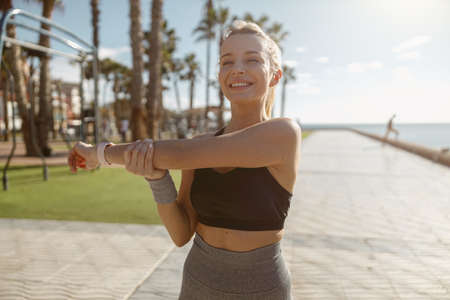 Caucasian female at daily fitness regime outdoorsの写真素材