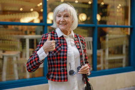 Photo of senior woman on street of townの写真素材