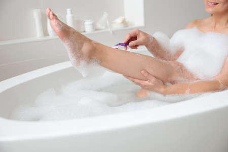 Woman remove leg hair, skincare and healthの写真素材