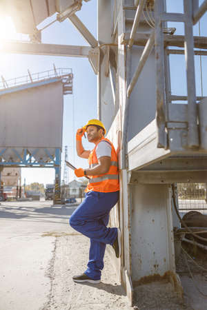 Young engineer working hard on concrete plantの写真素材