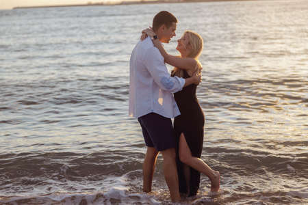 Full-length photo of couple dancing by the seaの写真素材