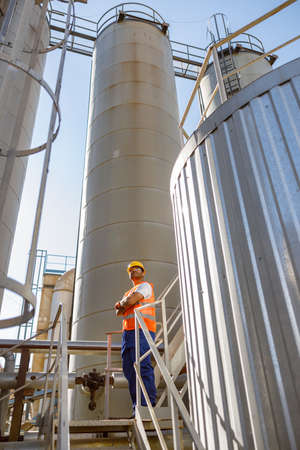 Industrial worker on his job at construction plantの写真素材