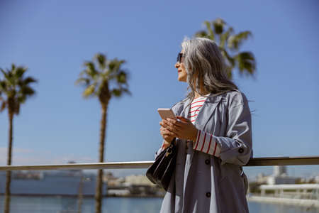 Happy and healthy woman enjoying good day outdoorsの写真素材