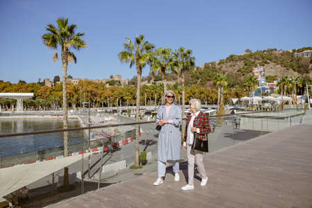 Shot of adult modern women resting outdoorsの写真素材