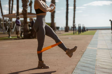 Young woman going in for sport on summer dayの写真素材