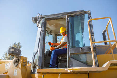 Experienced construction worker working hard at factoryの写真素材