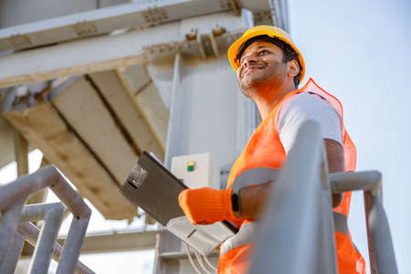 Photo of happy male multiethnic worker in plantの写真素材