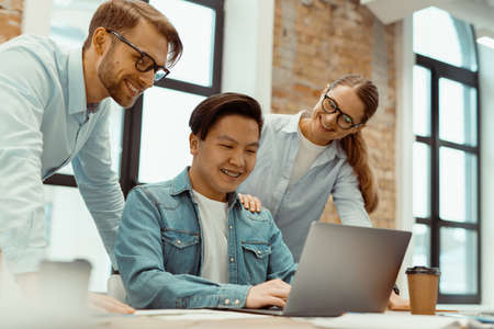 Business people conduct meeting with laptop in modern officeの写真素材