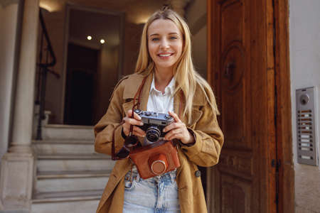 Woman standing at entrance to residential building