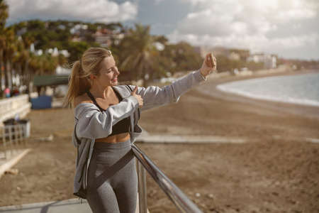 Caucasian fit female engaged in sports at seaの写真素材