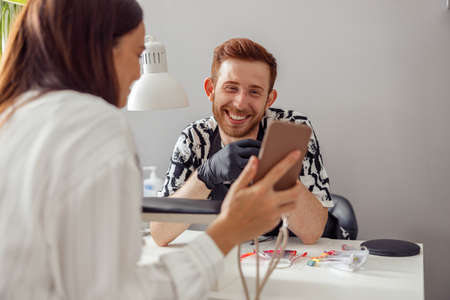 Confident woman client visiting modern manicure salonの写真素材