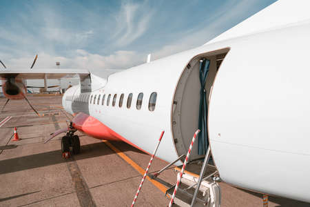 Close up of airplane standing in airport ready to flight