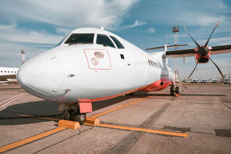 Close up of airplane standing in airport ready to flightの写真素材