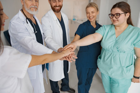 Close up of group of professional medical team of doctors putting their hands togetherの写真素材