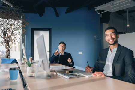 Group of business people working together in office during meetingの写真素材
