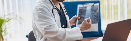 Therapist conducts video consultations, communicates with the patient through call by laptopの写真素材