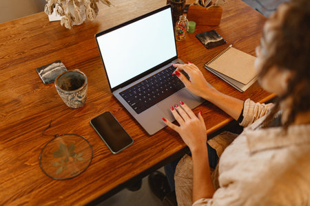 Close up of woman freelancer working on laptop on his workplace at homeの写真素材