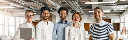 Diverse group of colleagues enjoying working together in an office. Teamwork conceptの写真素材