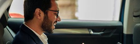 Businessman have a business meeting via video call while riding in car to office