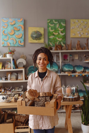 Smiling Woman working in home decor studio with elements of interior decorationsの写真素材