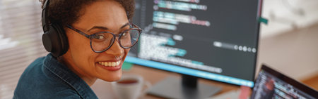 Female freelancer making new project as web designer and programmer on her computer at home office