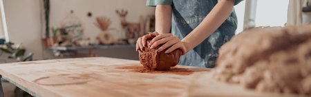 Photo of process of creating pottery by hands in workroomの写真素材