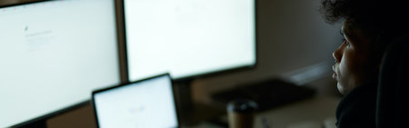 Be busy. Skilled specialist, guy sitting in front of many computer monitors, testing, finishing or...