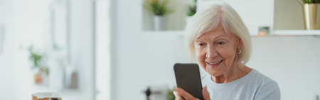 Photo of elderly lady with phone indoors