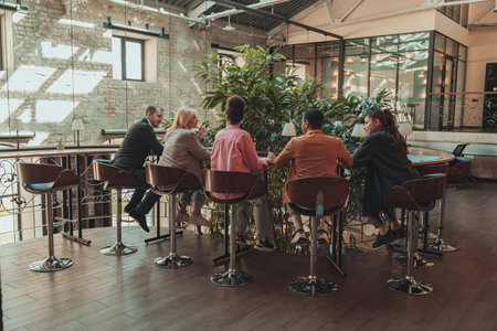 Group of coworkers working together and talking at modern office. Workplace and cooperation conceptの写真素材