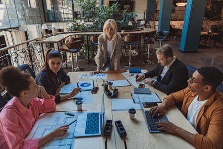 Executive team business people listening ceo negotiating discussing project results at board meetingの写真素材
