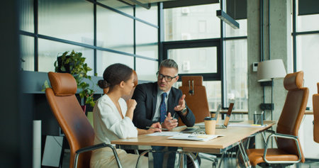 Businessman listening carefully to colleagueの写真素材
