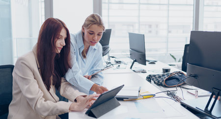 Engaging in Collaborative Office Work Enhanced by Innovative Technology and Toolsの写真素材