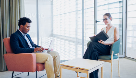 Engaging in a Professional Meeting in a Contemporary Office Setting That Inspires Creativityの写真素材