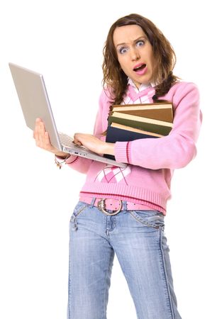 girl with laptop and pile of books in panic. isolated on whiteの写真素材