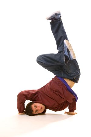 young b-boy standing in freeze. isolated on whiteの写真素材