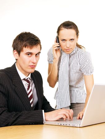 young businessman with laptop and secretary with phone over white backgroundの写真素材