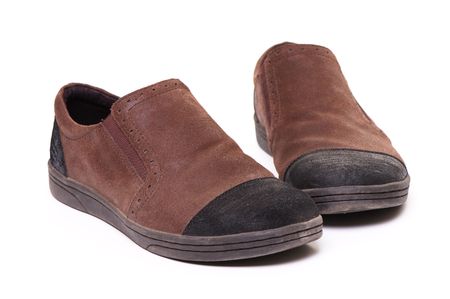 pair of brown shoes over whiteの写真素材