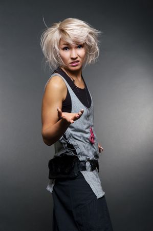 dissatisfied casual woman over dark backgroundの写真素材