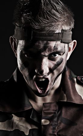 soldier in camouflage ready for the attackの写真素材