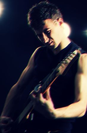 emotional guitarist playing at the stageの写真素材