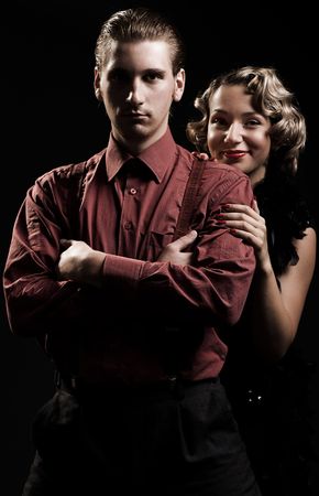 smiley woman hiding behind the serious man. retro styleの写真素材