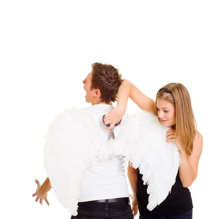bad girl cuting wings of angelの写真素材