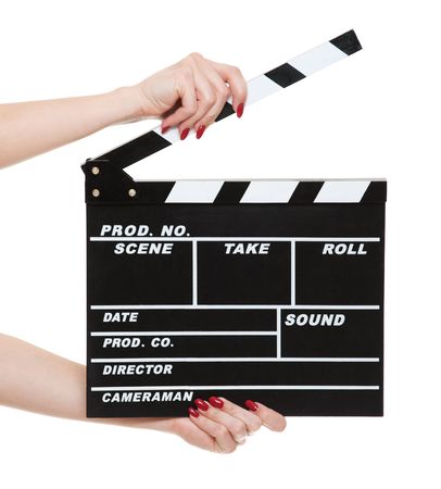 cinema clapboard in female hands isolated on white backgroundの写真素材