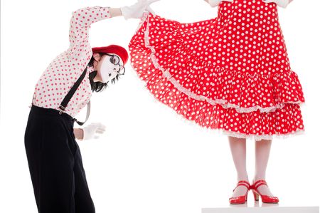 portrait of mimes. man looking under womans dress with big interest. isolated on white backgroundの写真素材