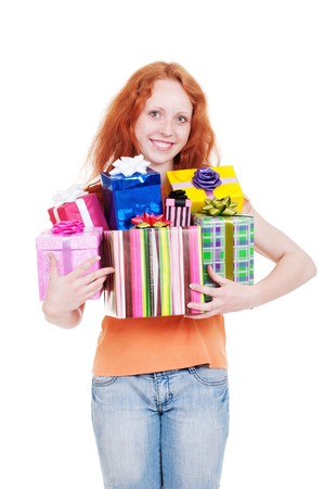 pretty red-haired girl holding many gift boxesの写真素材