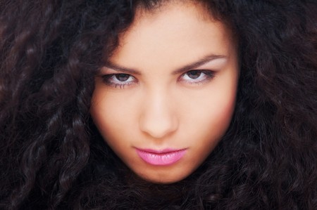 portrait of graceful woman with curly hairの写真素材