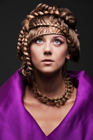 portrait of beautiful woman with hairstyle over dark background