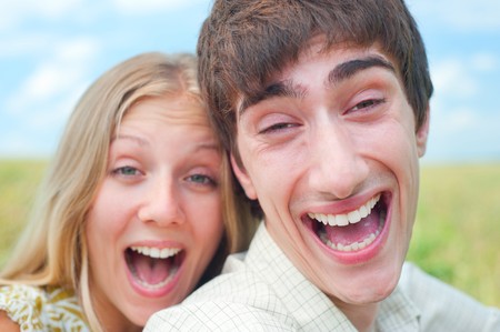 portrait of happy couple over blue skyの写真素材