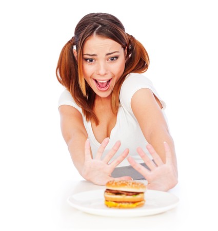 portrait of emotional woman with burger. isolated on white backgroundの写真素材